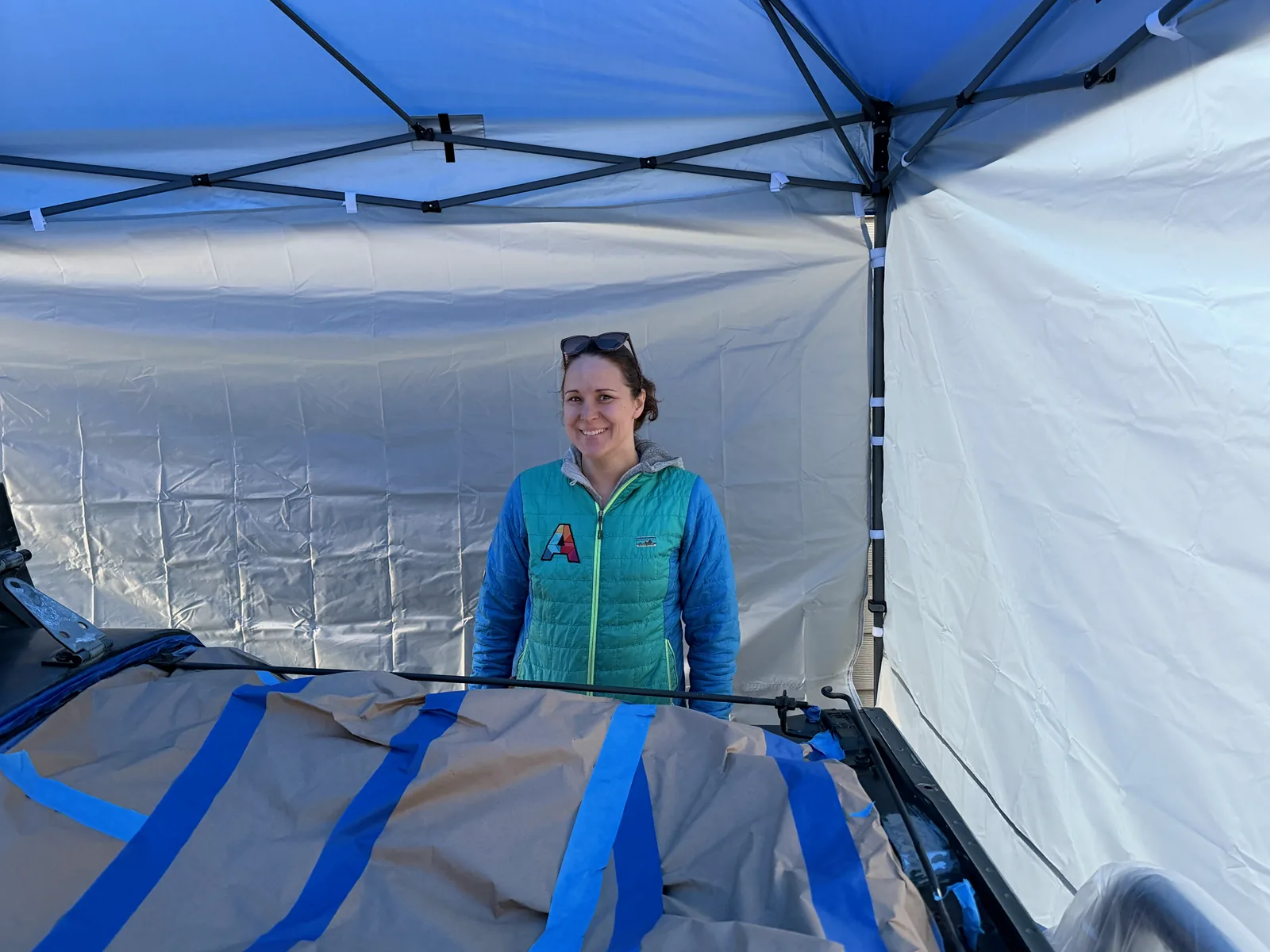 Teryn smiling under the work canopy