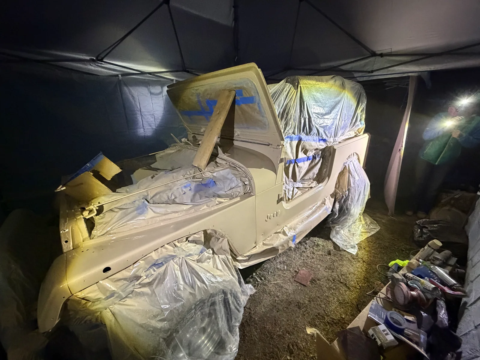 Priming the hood and trim pieces under the canopy