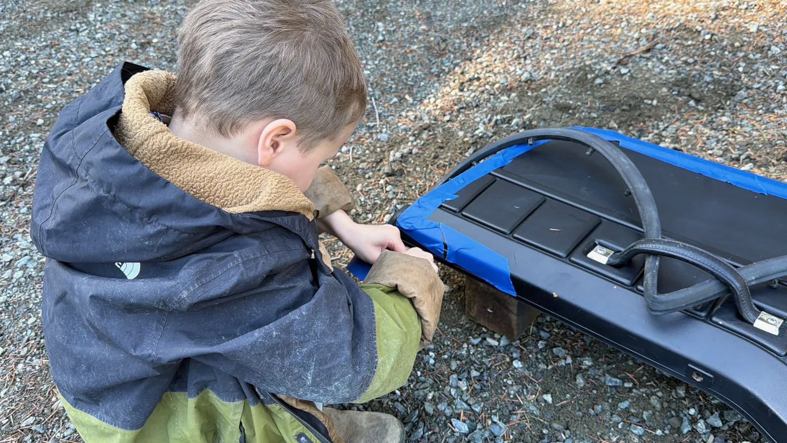 Our son working on a fender, replacing mounting nuts with rivets