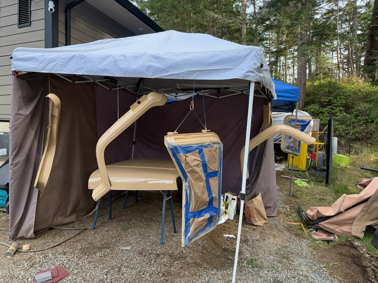 The tan Jeep fully masked off and ready for the red paint