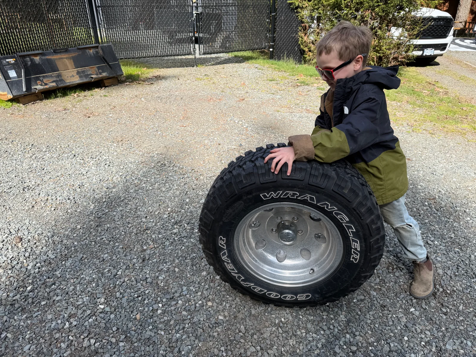Our son leaning proudly against one of the Jeep's tires