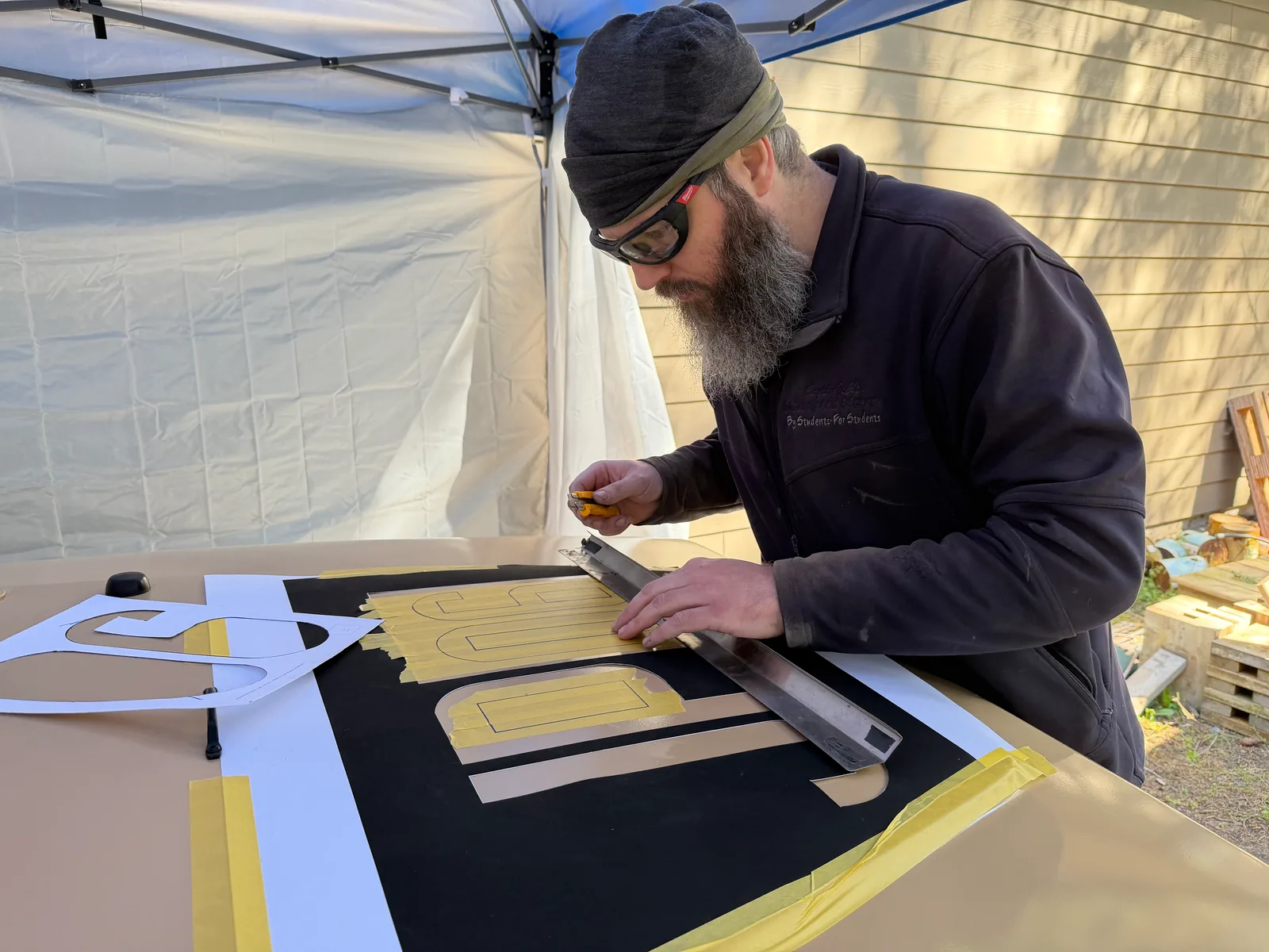Cutting out the side numbers and decals by hand with a knife