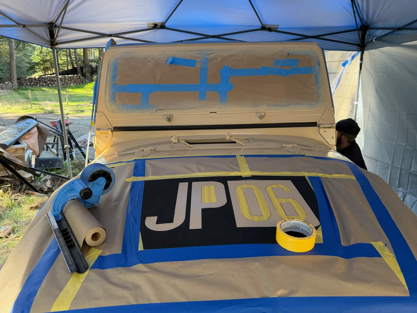 The hood masked off with the 'JP 06' number ready to paint