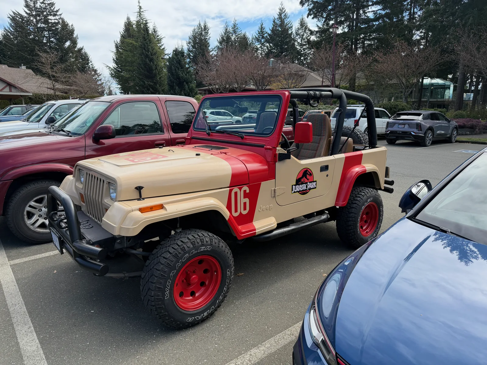 The finished Jurassic Park Jeep parked in a lot, front three-quarter view